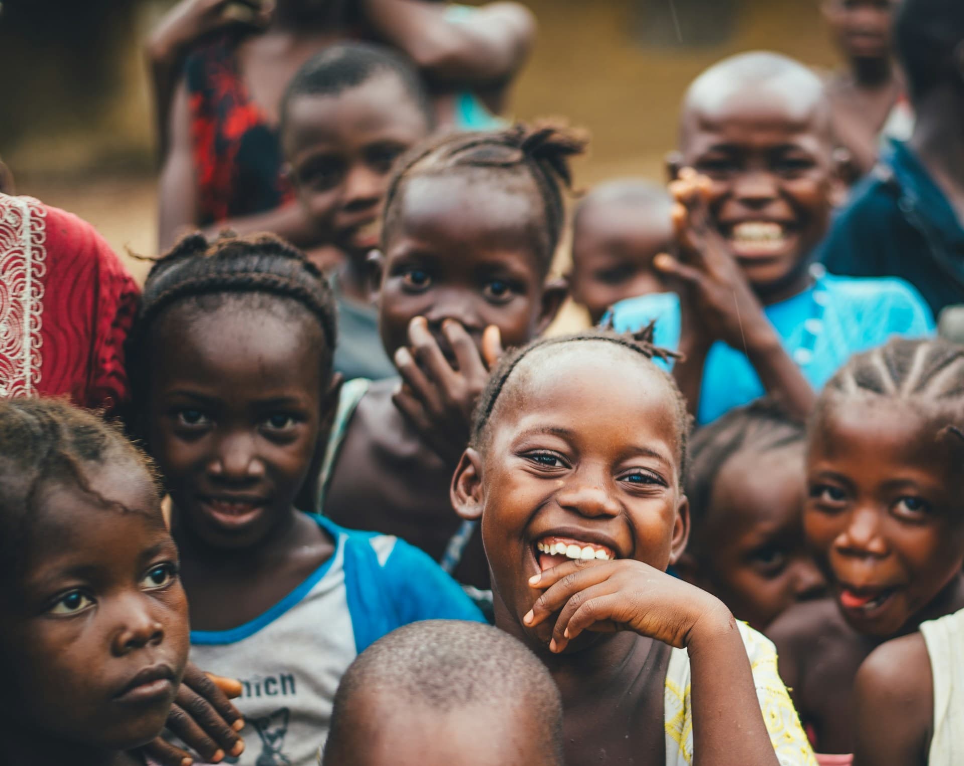 Happy children and community members in Nigeria